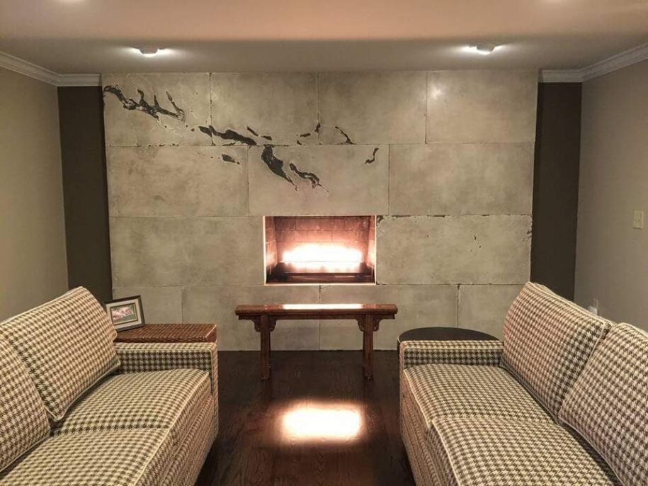 a white and black marble-look concrete fireplace